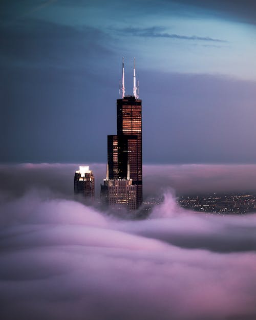 Photo Of Tower Above Clouds