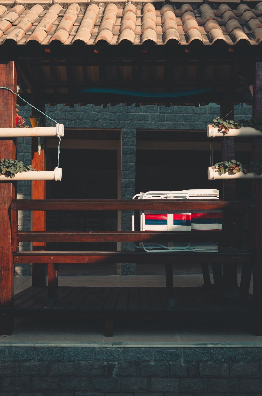 Wooden pergola over an outdoor seating area