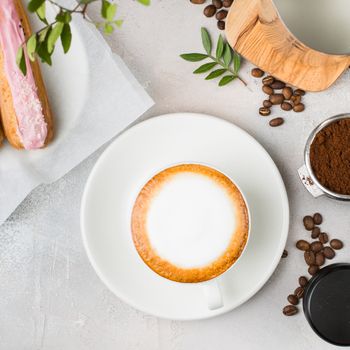 Cappuccino and pastry from above.