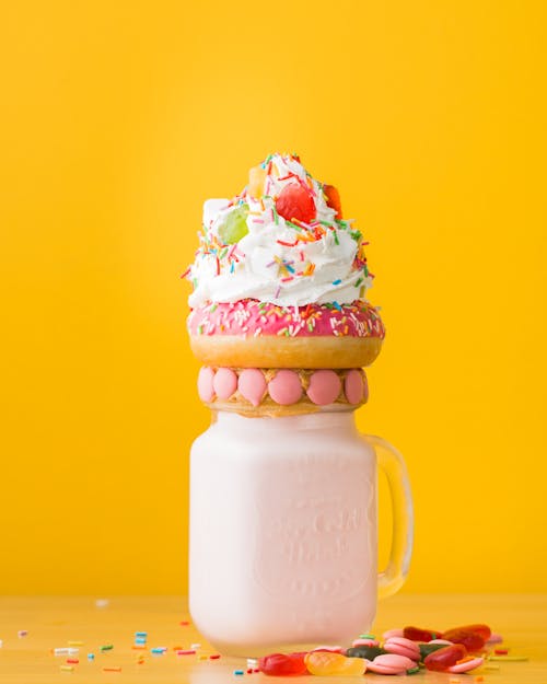 Close-Up Photo Of Dessert On Top Of The Jar