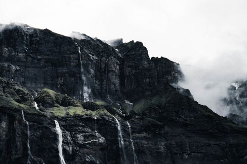 Free Dramatic waterfalls cascading down the cliffs at Sixt-Fer-à-Cheval, France. A stunning natural landscape. Stock Photo