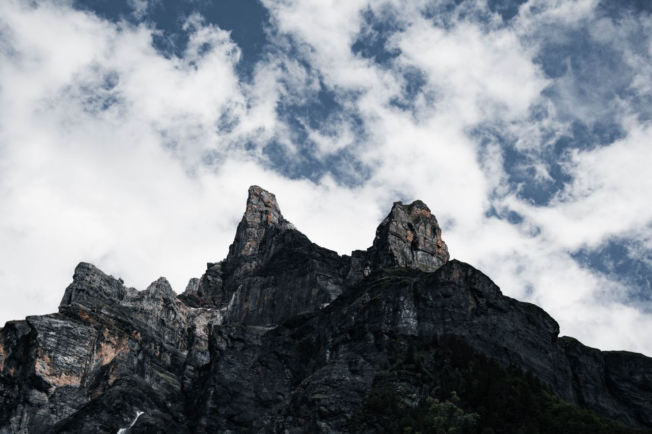 dramatic view of rocky peaks under a cloudy sky in sixt fer cheval fra