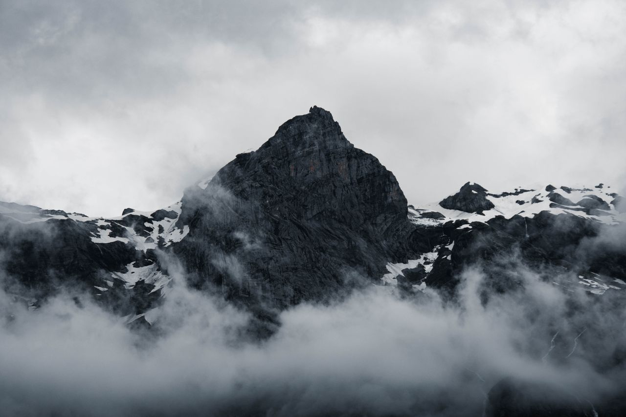 majestic peaks of sixt fer cheval in france enveloped in misty clouds