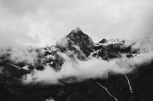 Free Black and white photo of a misty mountain peak in Sixt-Fer-à-Cheval, France. Stock Photo