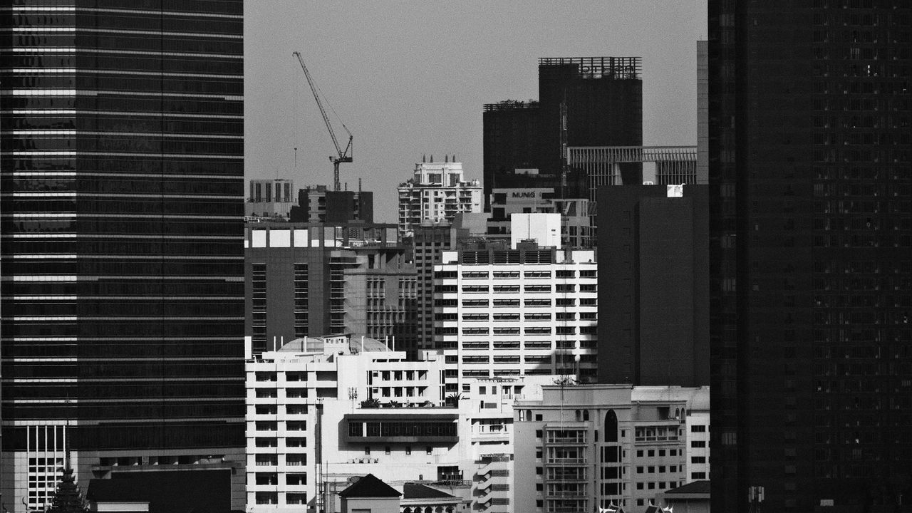 monochrome aerial view of a city s downtown skyscrapers creating a den