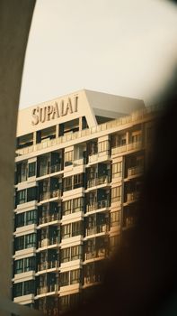 Close-up of a contemporary apartment building facade with balconies in an urban setting.