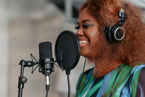 A woman singing into a microphone