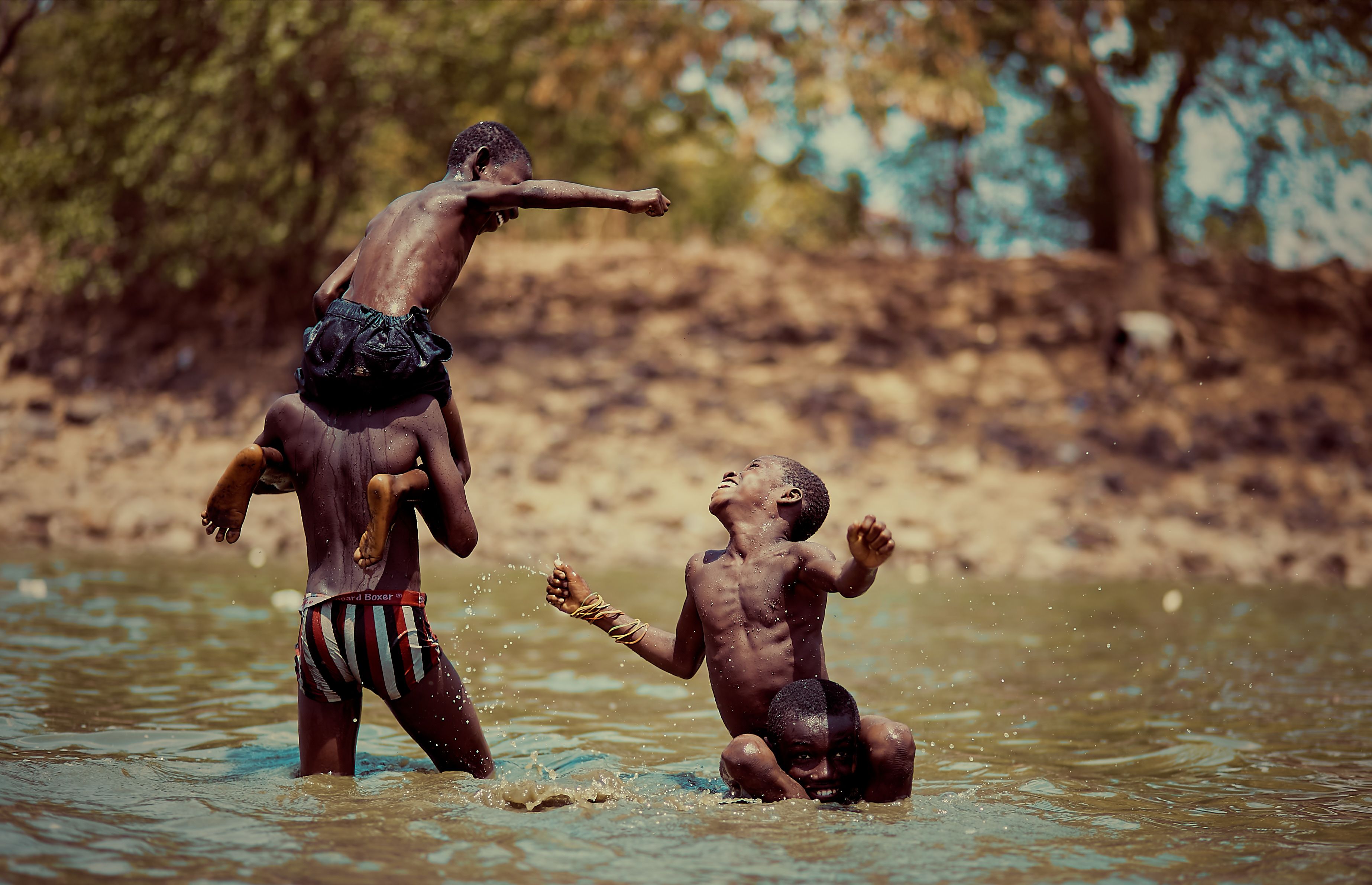 Children playing on a body of water