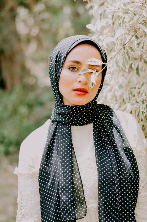 Woman Wearing White and Black Dress and Headscarf