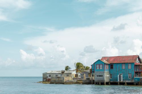 Free Charming coastal houses by the sea in San Andrés, Colombia, with blue skies. Stock Photo