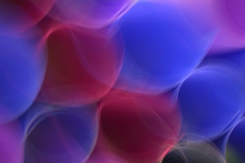 Free Colorful abstract light bokeh with soft circles in blues and reds. Stock Photo