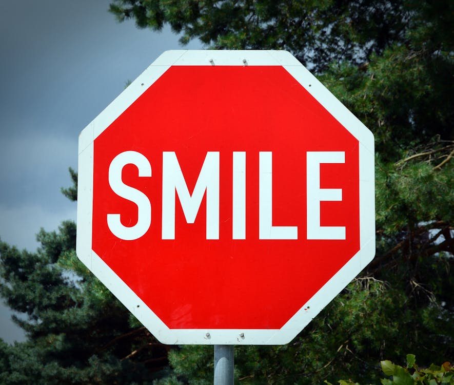 Red and White Smile Signage