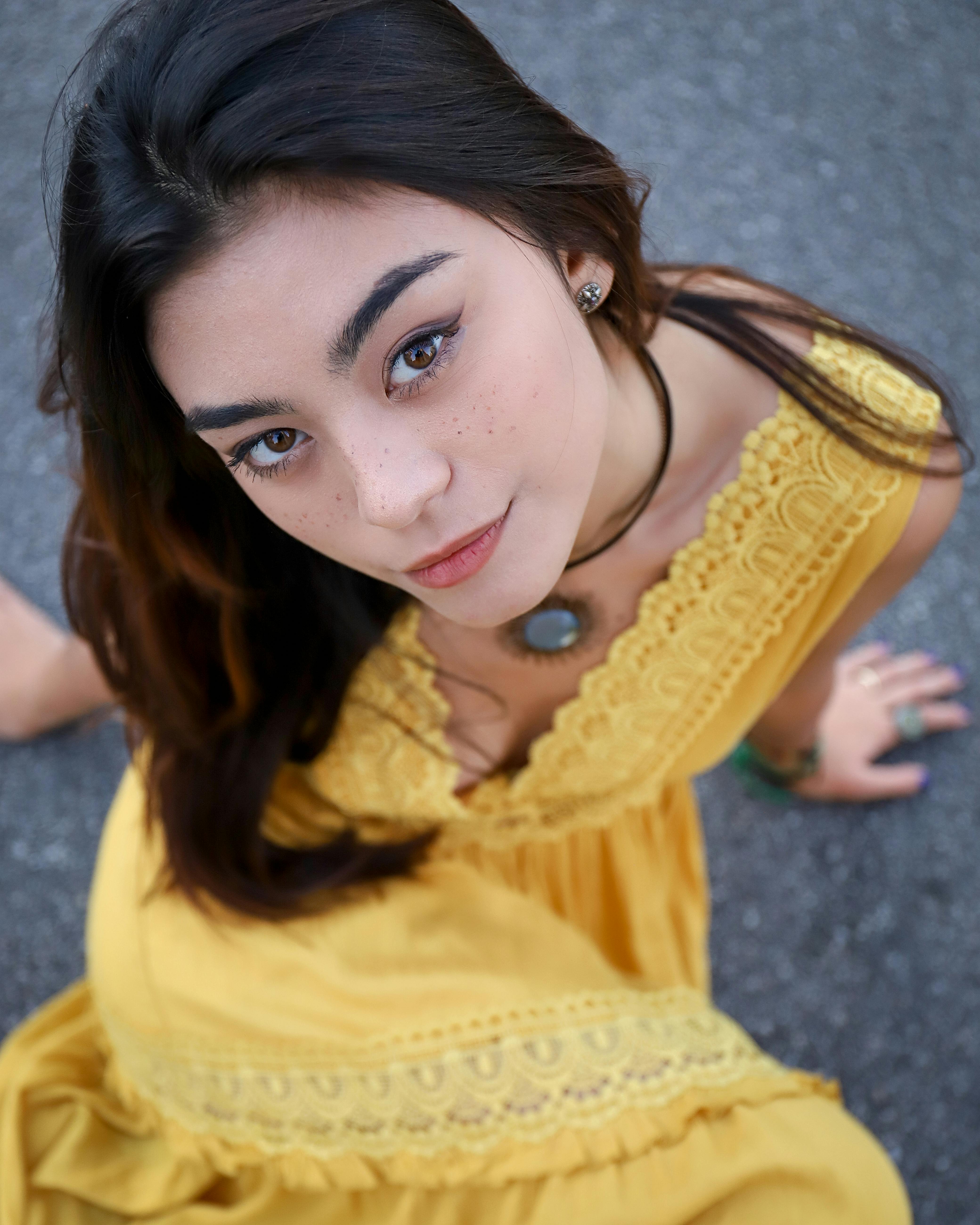 photo of woman wearing yellow dress