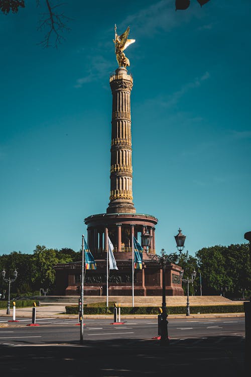 A monument with a statue on top of it