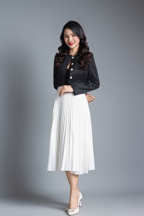 Pleated midi skirt with a crisp white blouse