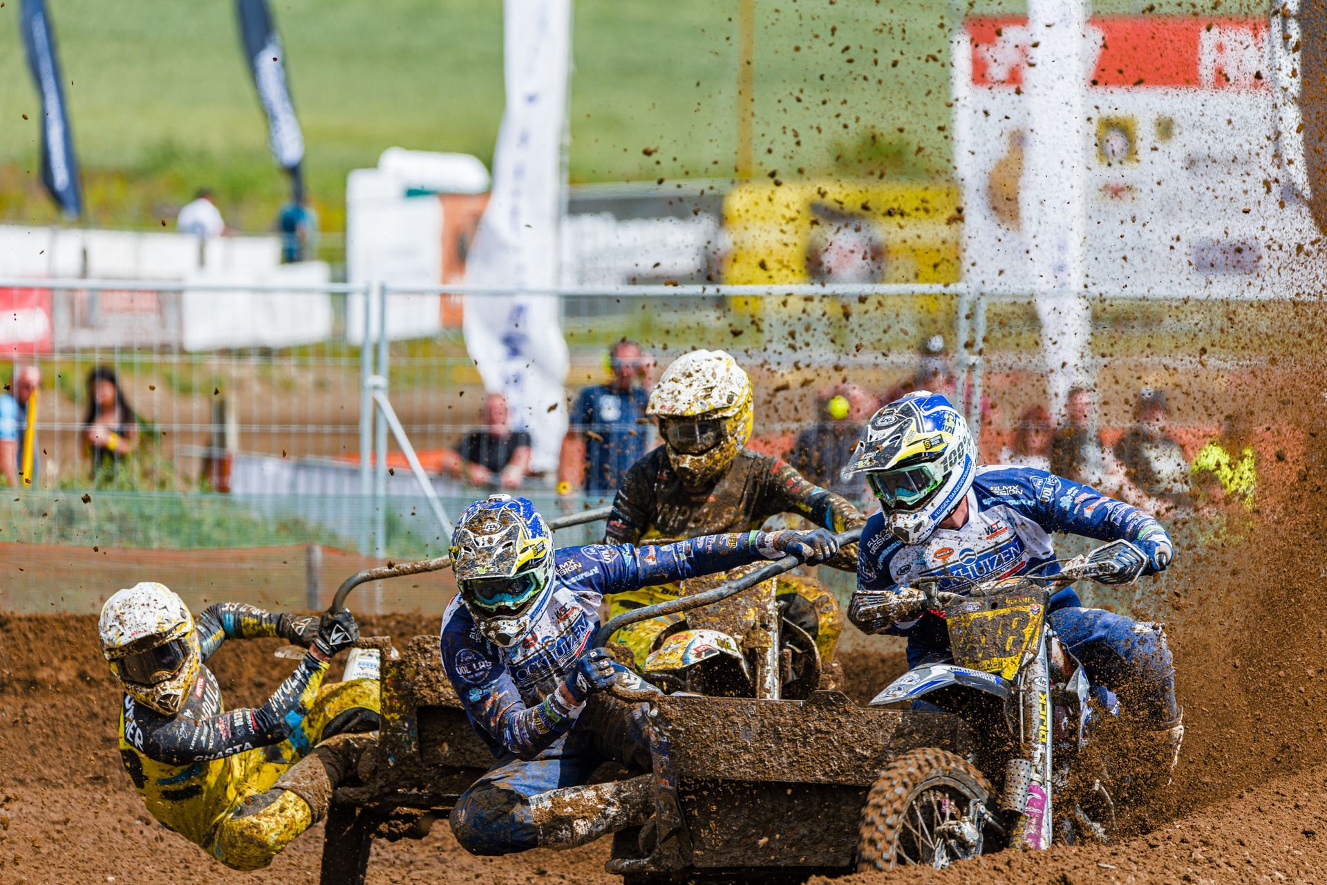 Sidecar Motocross Teams Racing on Dirt Track
