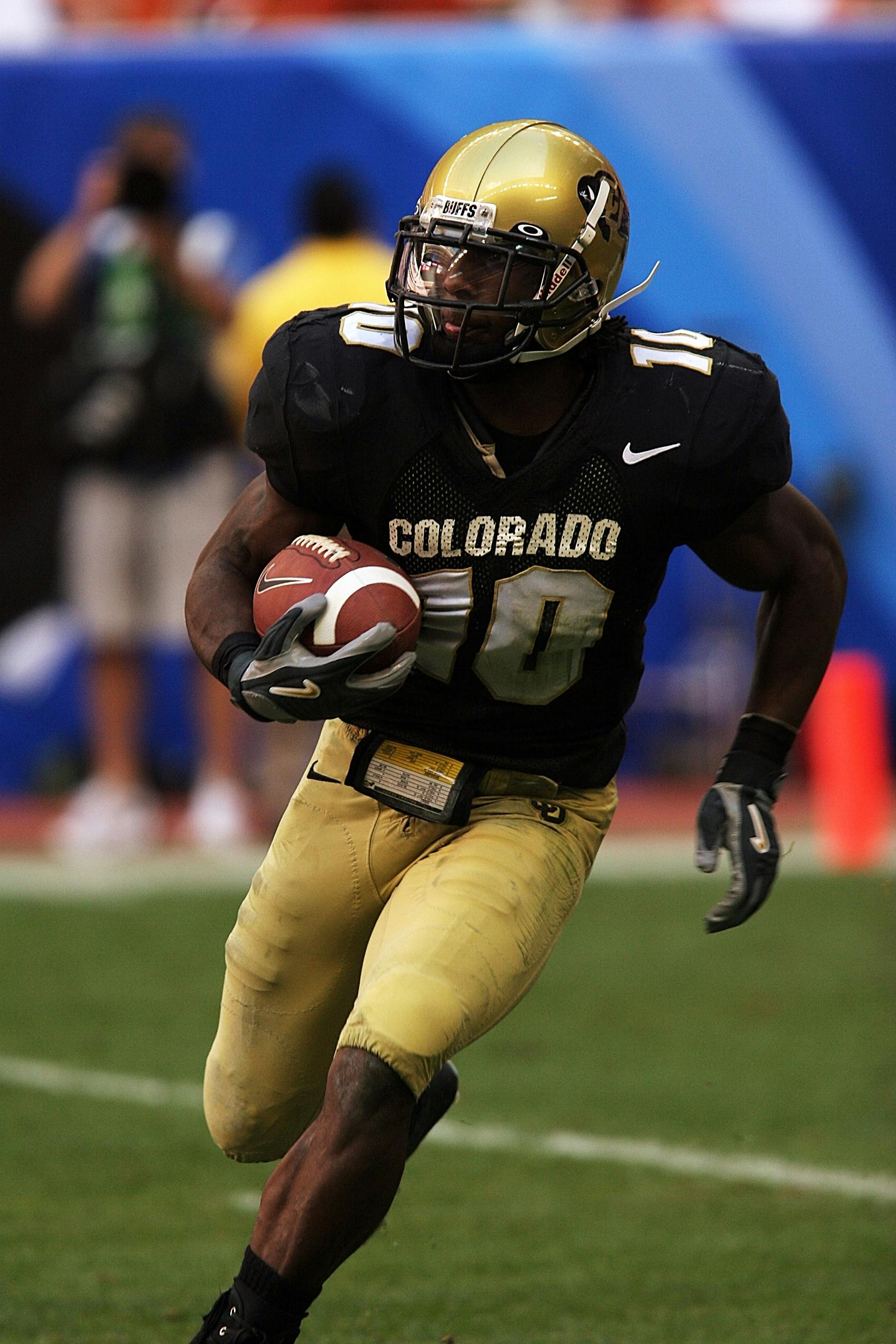 selective focus photography of man playing american football