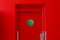A red door with a green circle in the middle