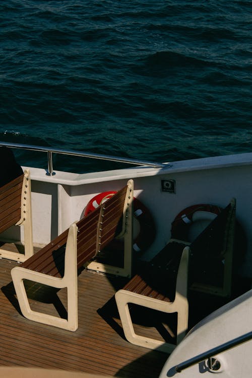 A boat with a bench on the deck