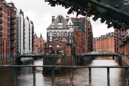 A bridge over a river with a city in the background