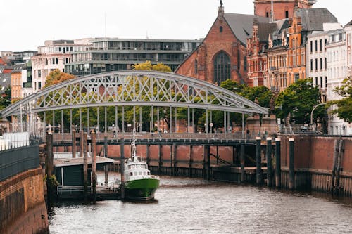 Free A boat is docked in front of a bridge Stock Photo