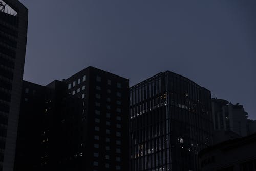 A dark silhouette of buildings in the city