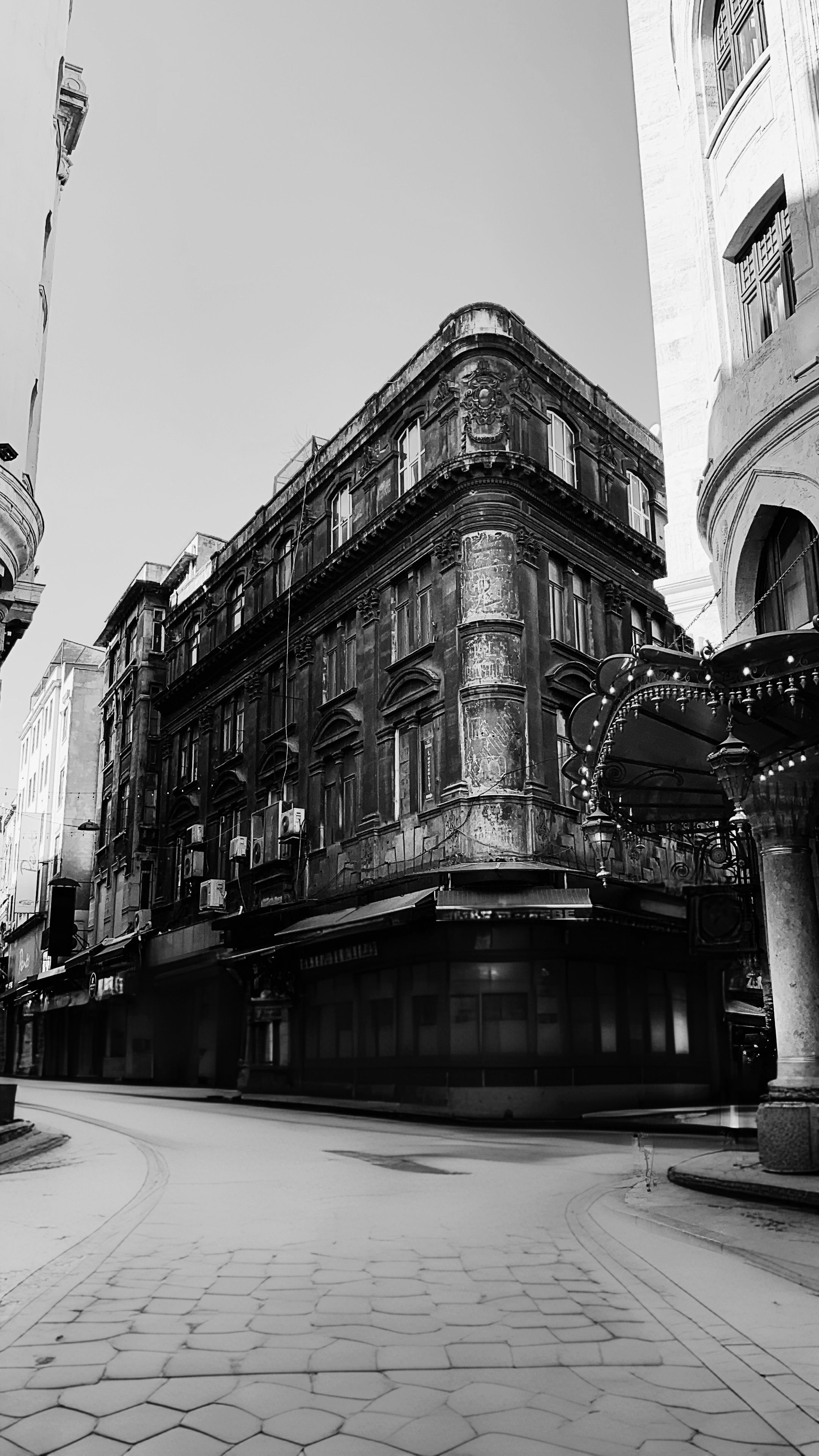 Monochrome view of historic building in İstanbul's city streets. Architectural charm.
