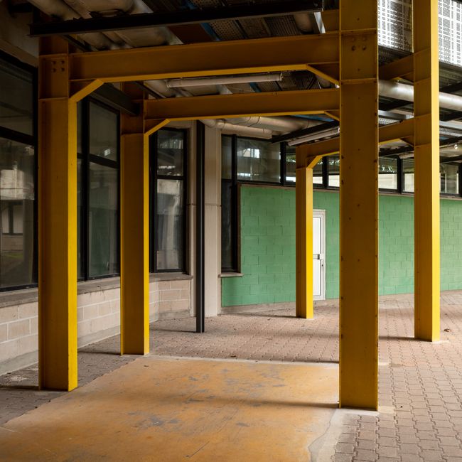 converted brick warehouse interior with steel beams