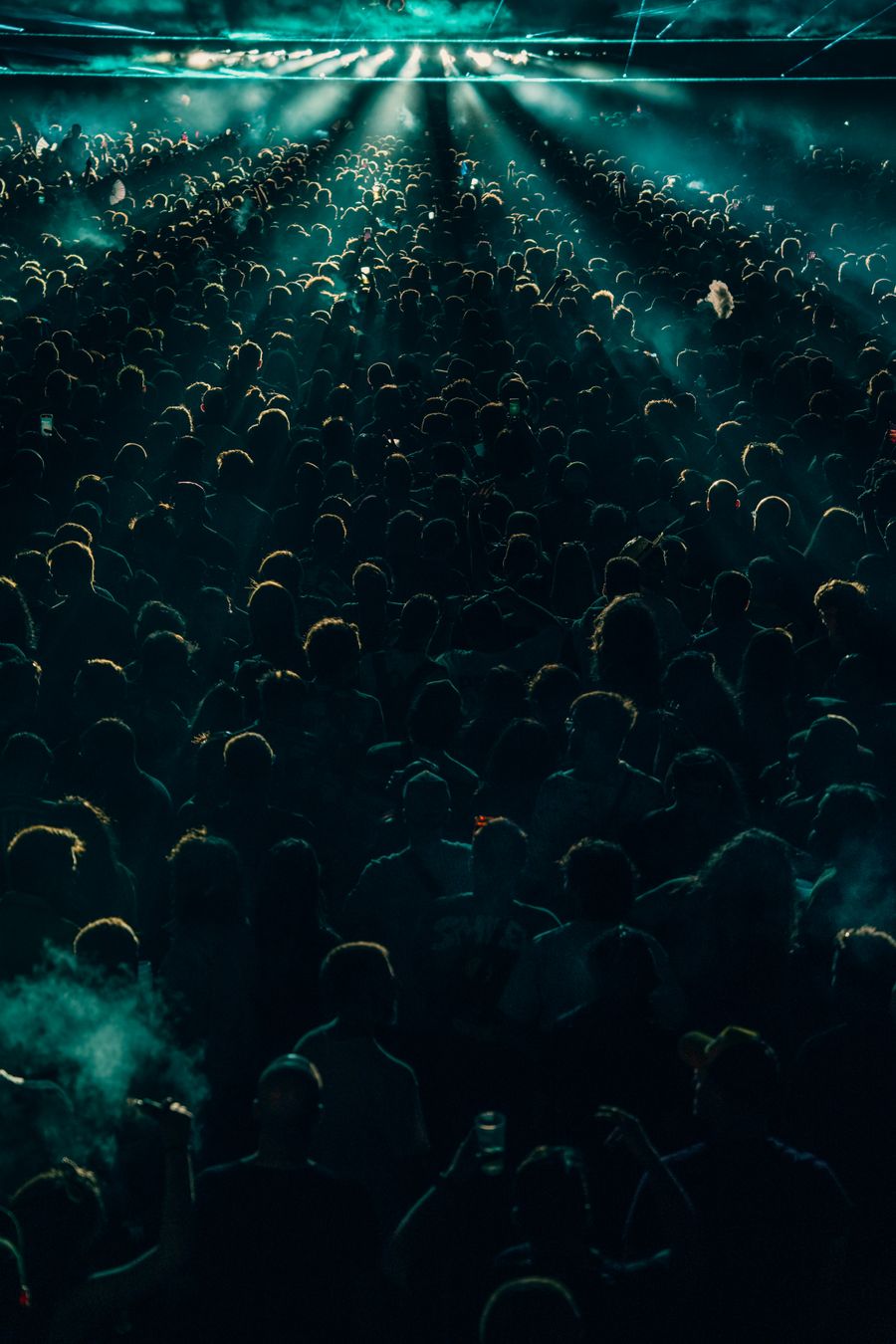 Concert crowd under dramatic lighting — photo by Noland Live on Pexels