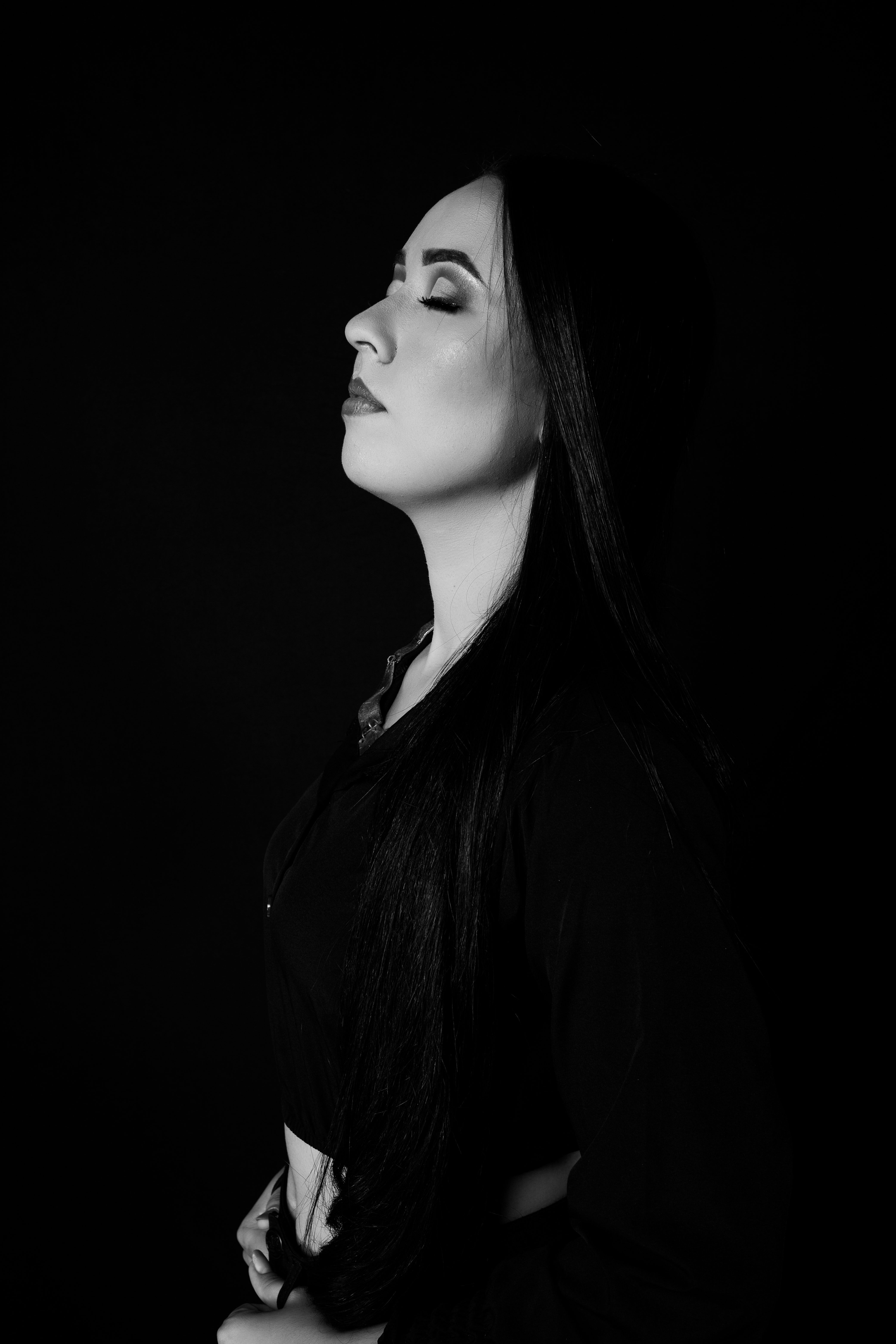A Woman Standing in a Dark Room · Free Stock Photo
