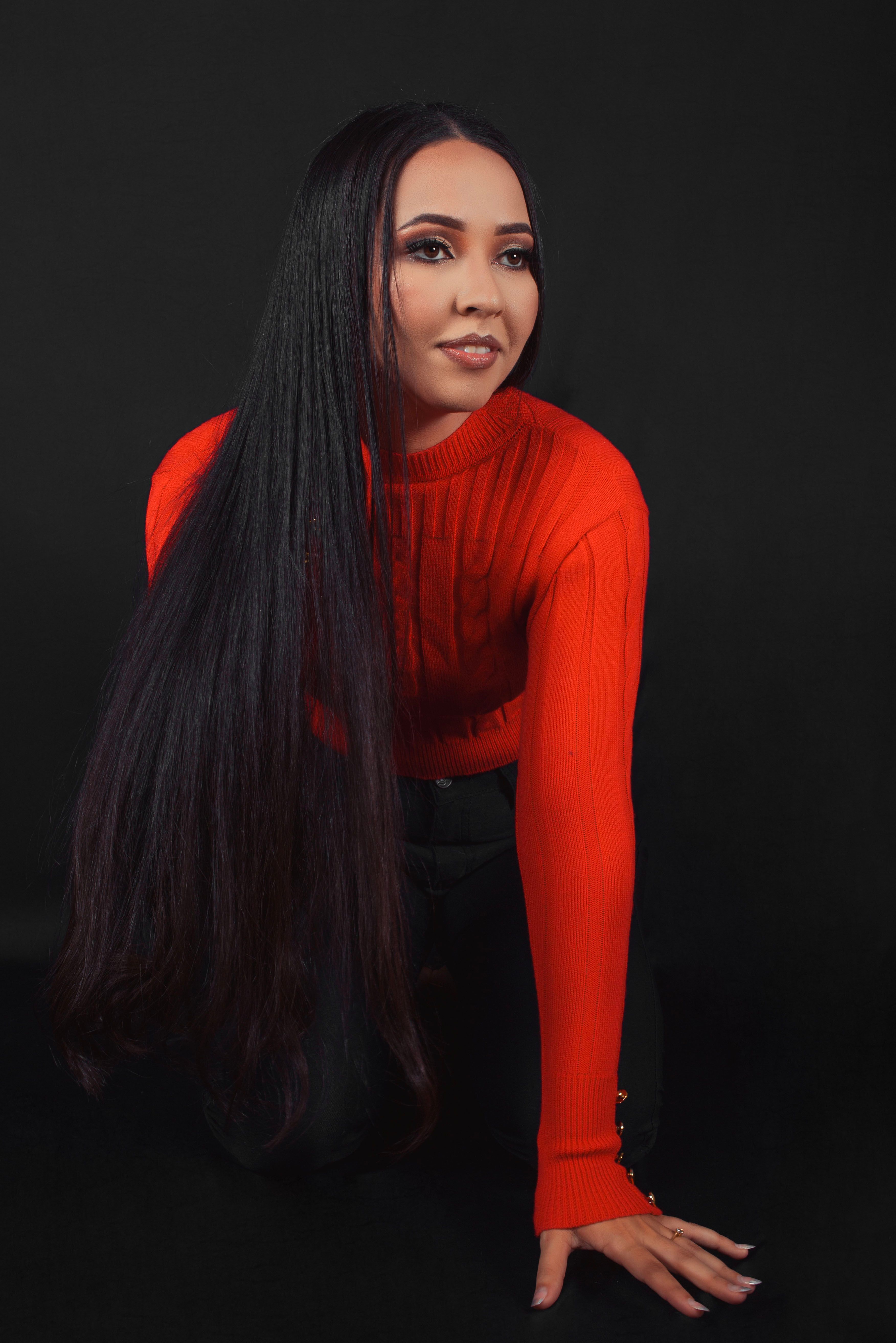 A woman with long black hair posing for a photo · Free Stock Photo
