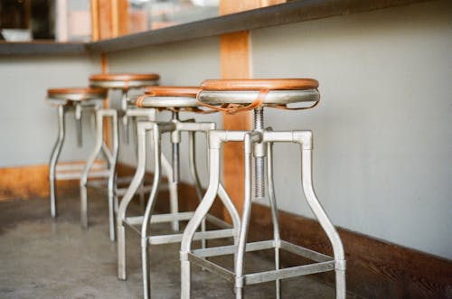 Shallow Focus Photography of Bar Stools