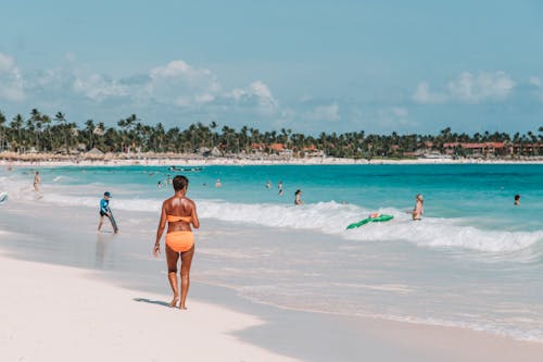 Woman Walking on Seashore