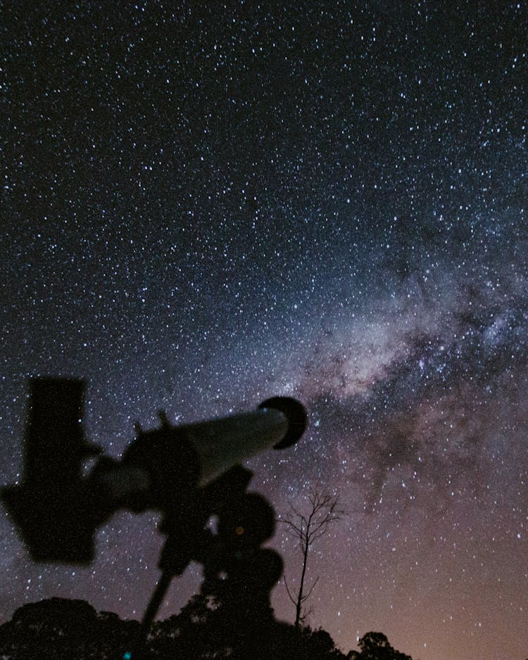 Telescope Pointing At Milky Way Galaxy At Night