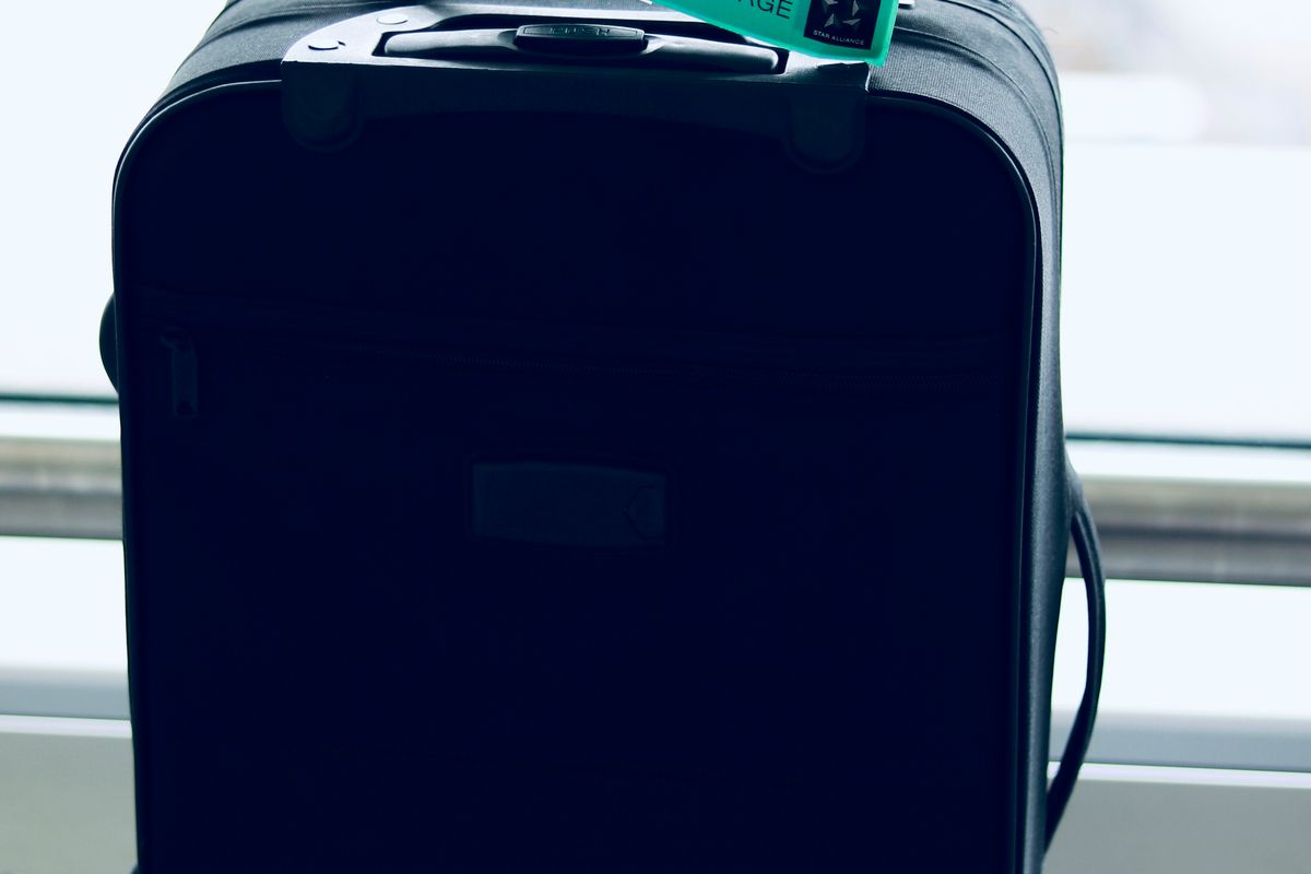 Hard shell suitcase standing on a floor