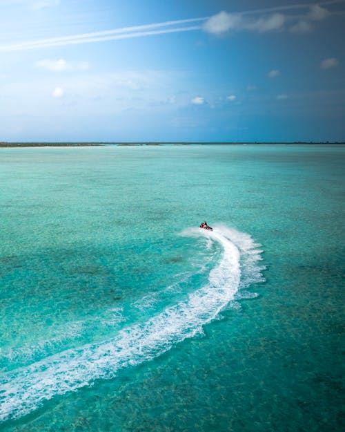 Free Aerial Photo of Person Riding a Jetski Stock Photo