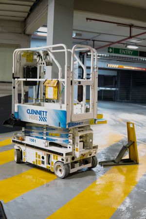 Blacked-out scissor lift at concert venue