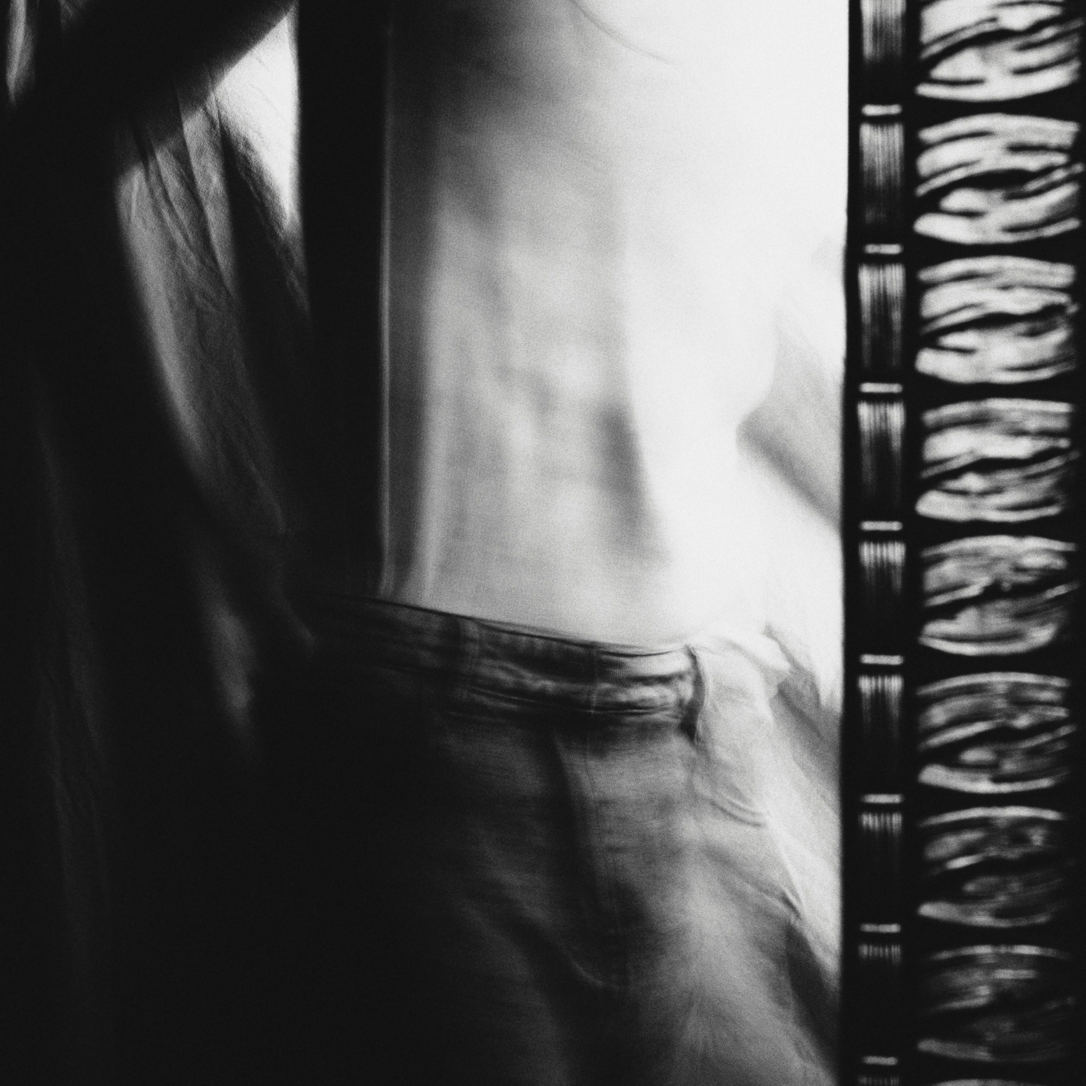Artistic blurred motion in black and white captures the essence of movement and abstraction.