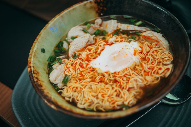 ramen bowl with a soft egg and green onions