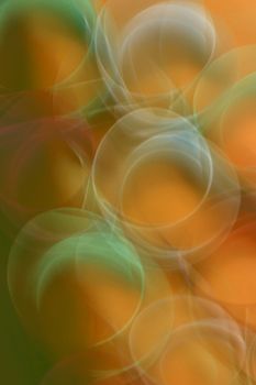A visually engaging abstract design featuring vibrant bubbles with an orange background.