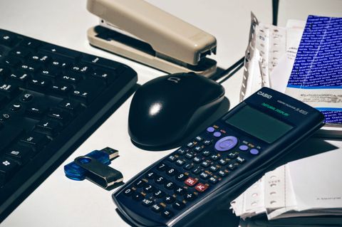Calculator and paperwork on a desk
