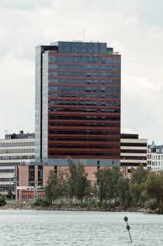 A modern skyscraper Quality Hotel in Jönköping, Sweden, framed by water and urban skyline.
