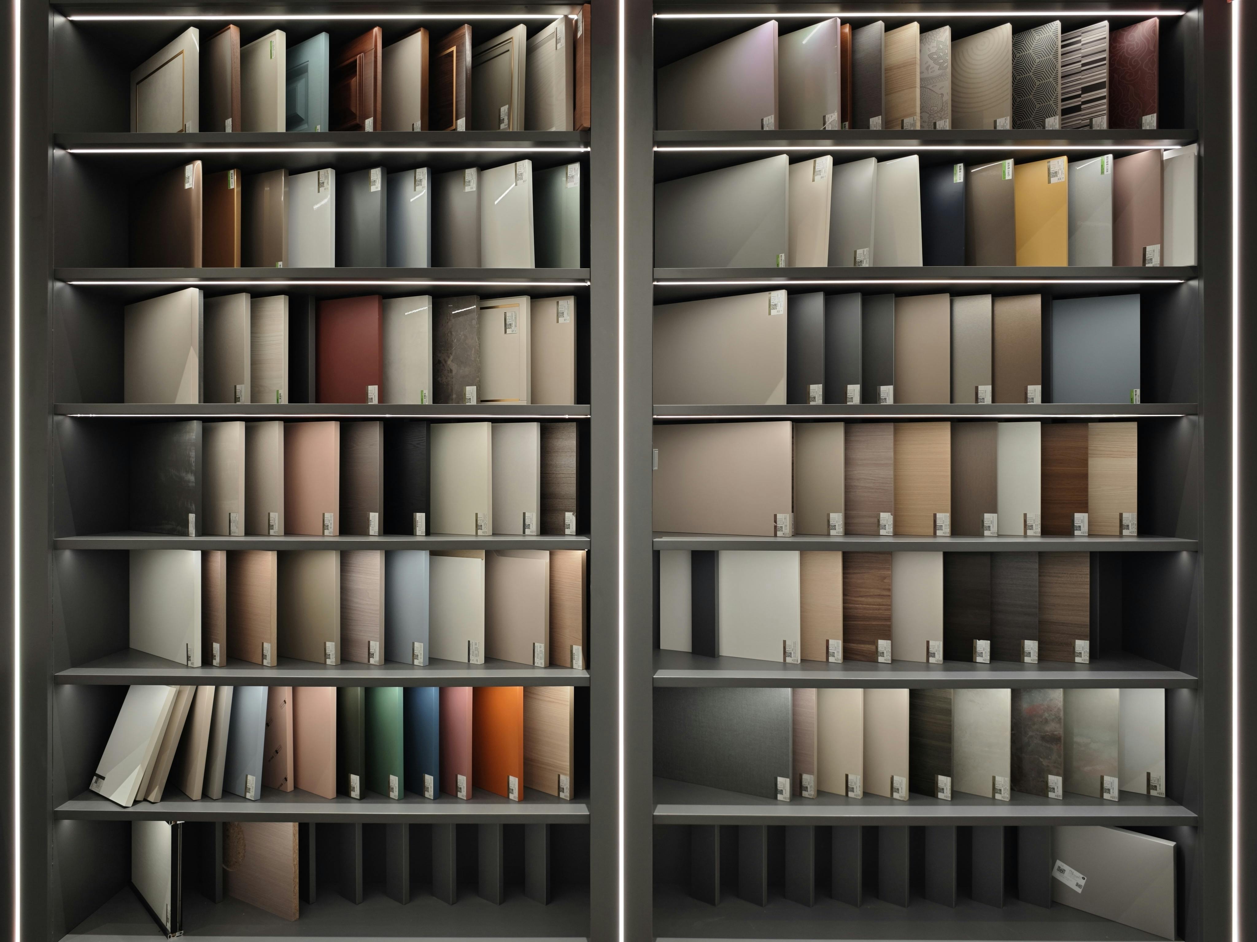 Rows of organized filing cabinets filled with document folders and material samples in an office setting.