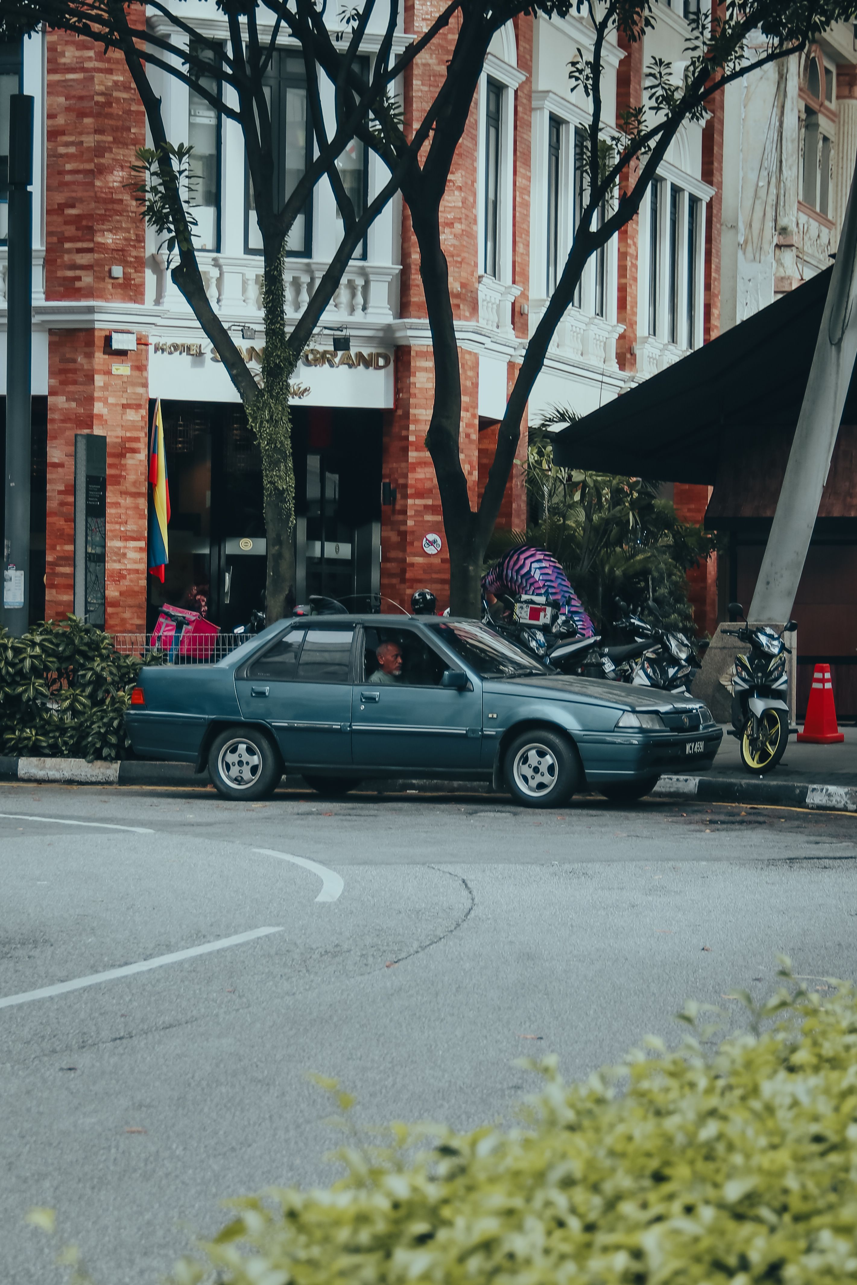 A car parked on the side of the road · Free Stock Photo