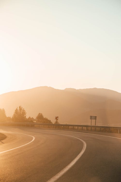 Free stock photo of mountains, road, sunset