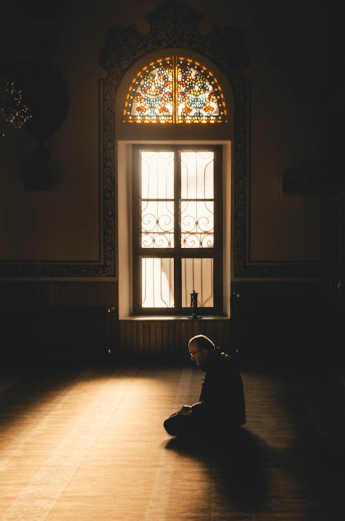 Free Photo Of Man Kneeling While Praying Stock Photo