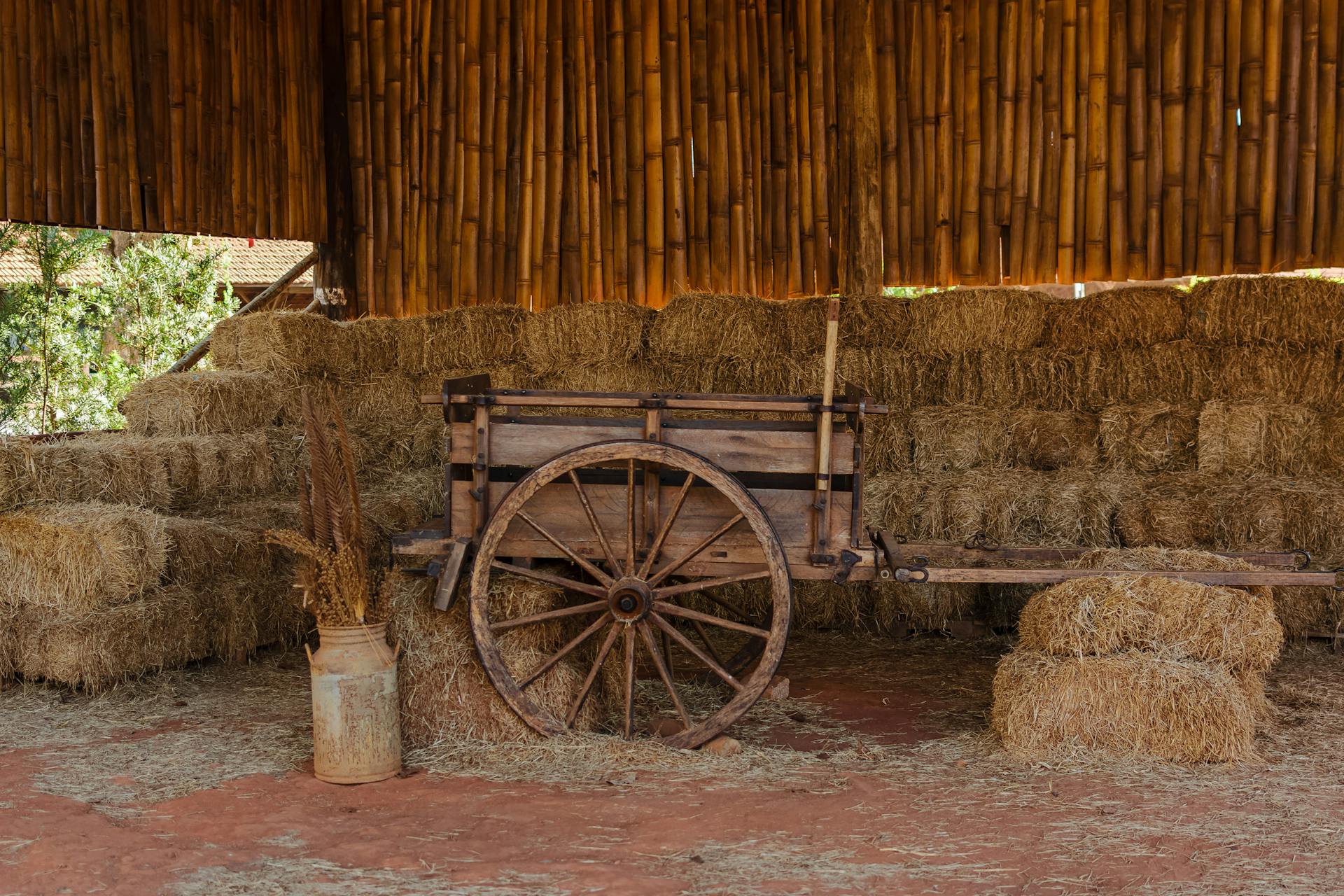 Hay Bales and Wooden Trailer in Barn