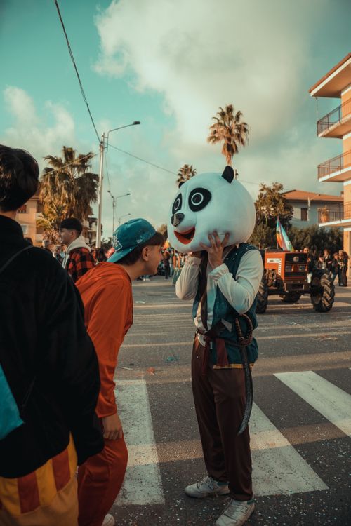 Free Joyful street celebration in Viareggio with festive costumes and lively crowd. Stock Photo