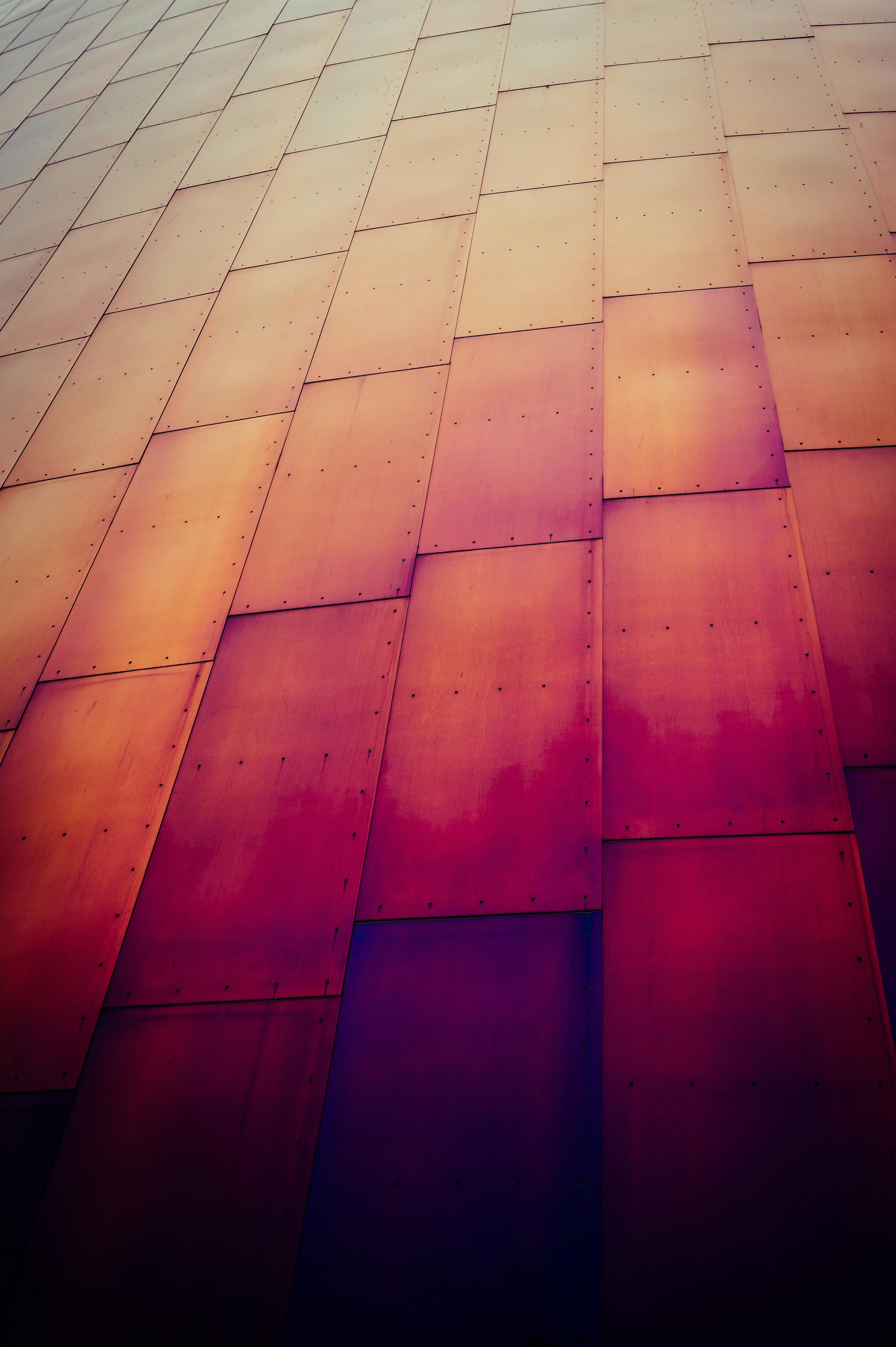 Abstract view of colorful rusted metal panels in Seattle, showcasing urban industrial design.