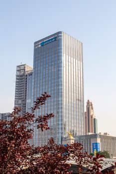 A clear view of the BDO Corporate Center in Ortigas, Manila, against a clear sky.